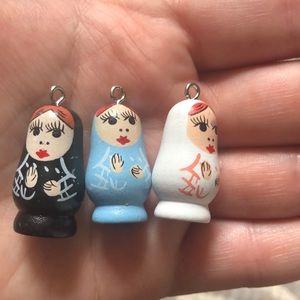 Three little wooden doll jewelry hangers